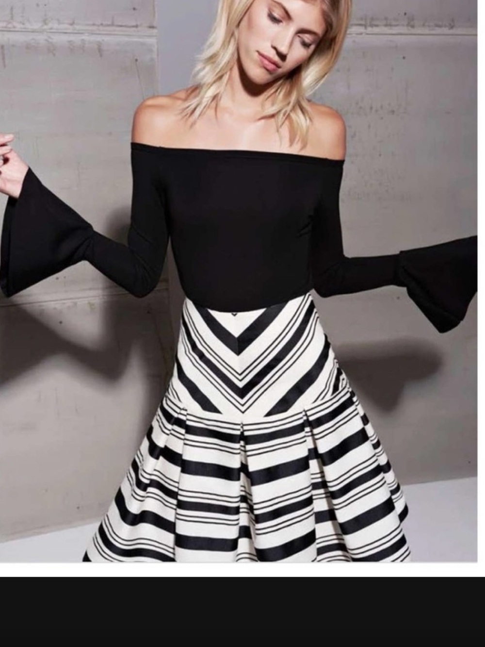 Alexis Lindes black bell sleeve top